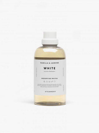 Bouteille de détergent à lessive blanche de Steamery, parfum vanille et jasmin, présentant un design épuré et une étiquette informative.