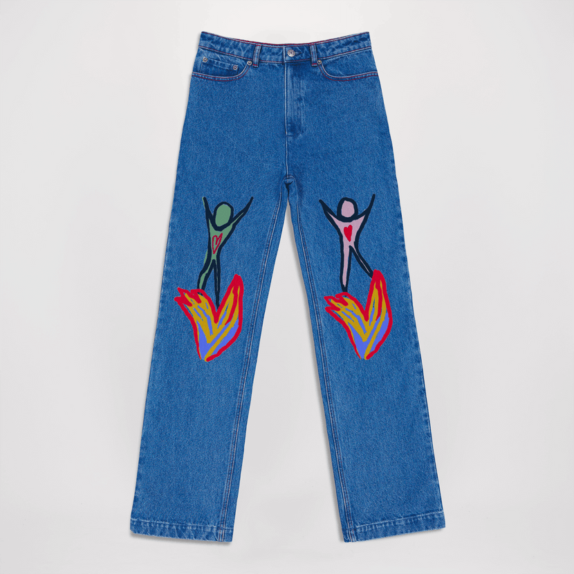 Jean peint "Brulons à deux" - blue présenté à plat, présentant des motifs colorés sur les cuisses, fabriqué par la marque Encré.