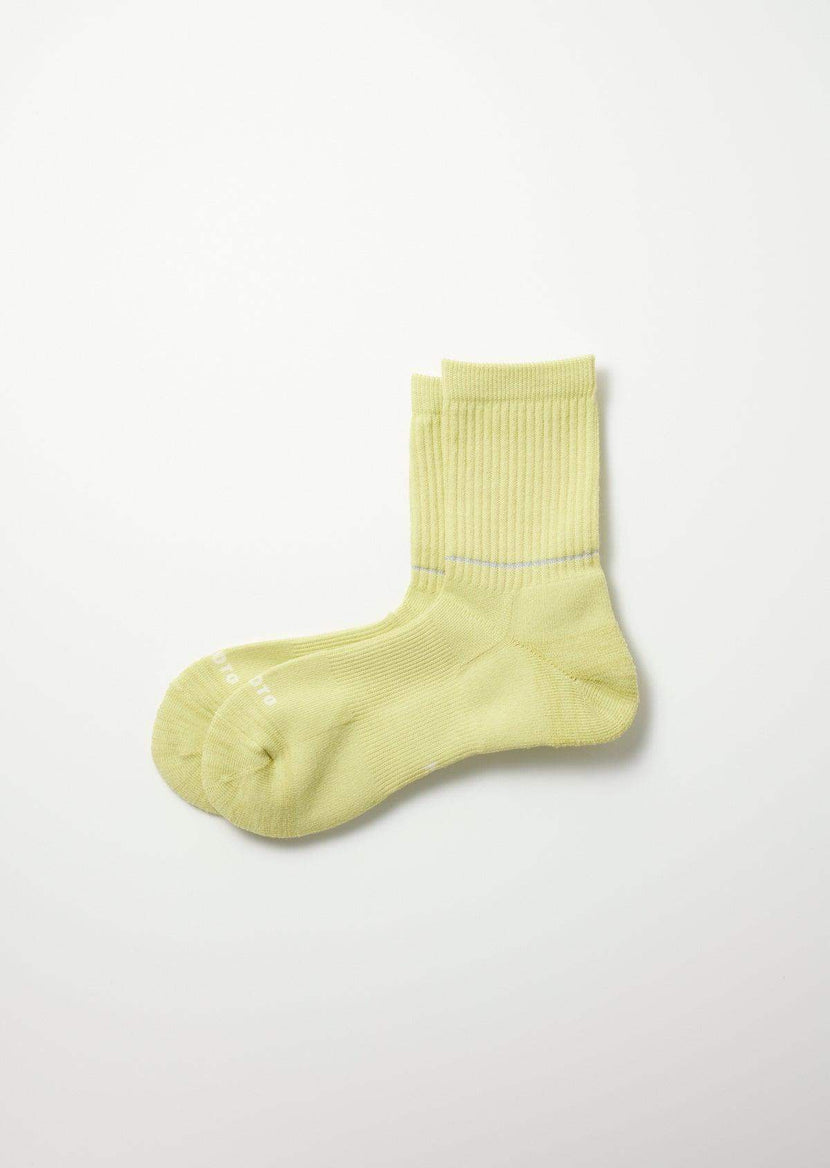 Chaussettes Rototo R1483 Lime, de couleur jaune clair, avec un design côtelé. Parfaites pour les activités en plein air ou le quotidien, alliant confort et style.