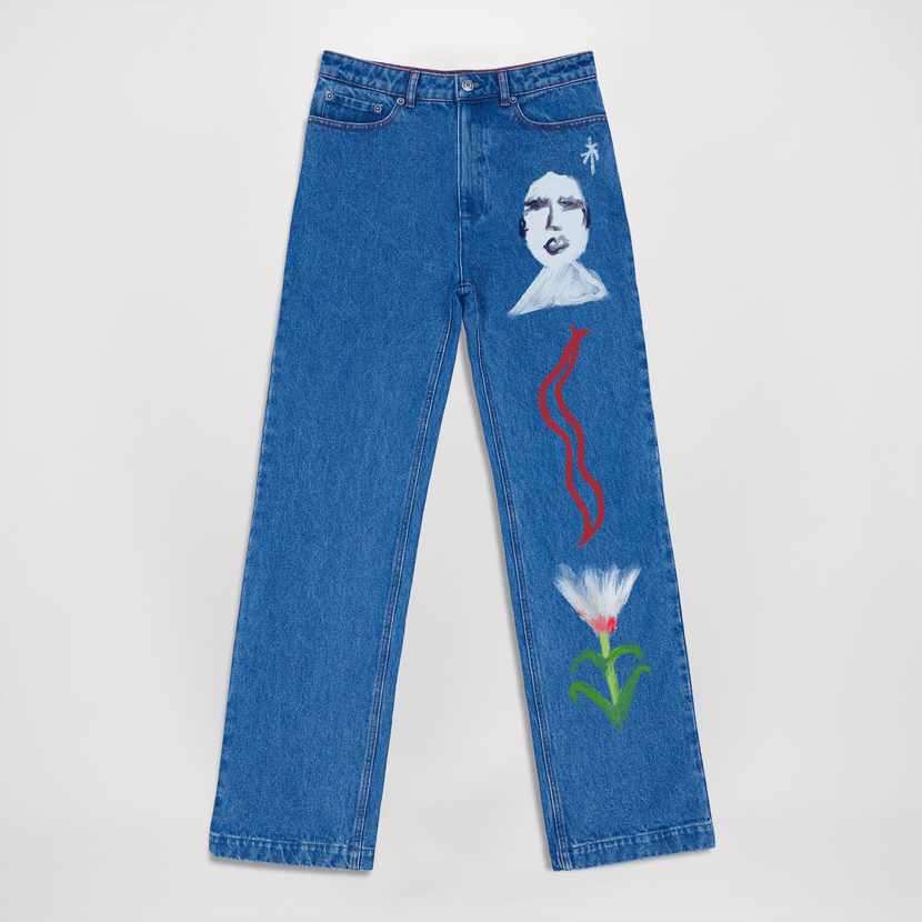 Jean peint Céleste - Blue d'Encré, avec une coupe large et des motifs artistiques colorés sur le pantalon. Parfait pour un look décontracté et stylé.