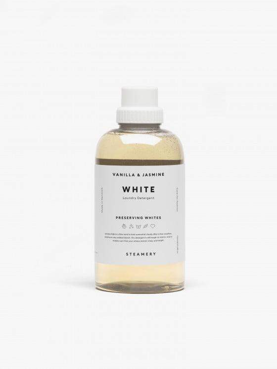 Bouteille de détergent à lessive blanche de Steamery, parfum vanille et jasmin, présentant un design épuré et une étiquette informative.